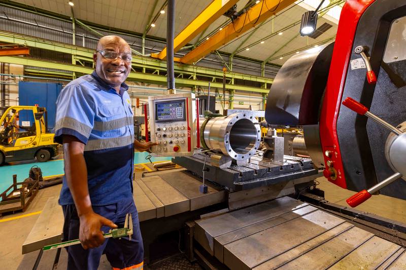 A technician is refurbishing a component at the Barloworld Rebuild Centre in Boksburg