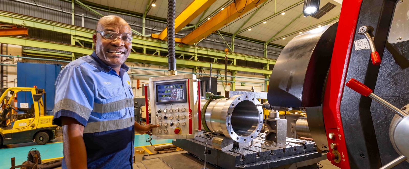 A technician is refurbishing a component at the Barloworld Rebuild Centre in Boksburg